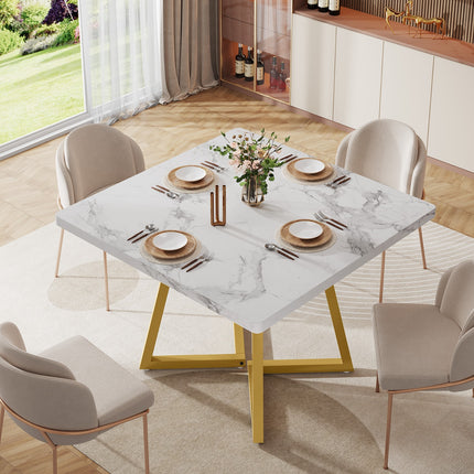 Moderne vierkante eettafel 80x80 cm met wit marmerlook tafelblad en goudkleurig metalen onderstel, vooraanzicht op witte achtergrond.