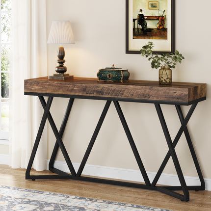 Industriële sidetable MEGIVEZ van 140 cm breed met bruin houten tafelblad van 10 cm dik, zwart geometrisch metalen onderstel, 30 cm diep en 90,5 cm hoog.