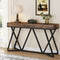 Industriële sidetable MEGIVEZ van 140 cm breed met bruin houten tafelblad van 10 cm dik, zwart geometrisch metalen onderstel, 30 cm diep en 90,5 cm hoog.