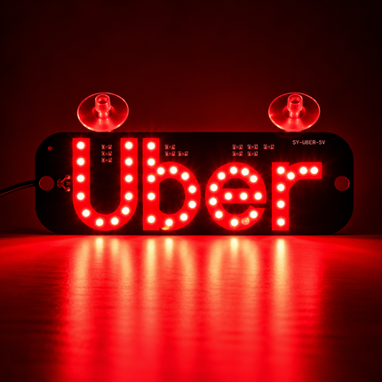 Uber LED verlicht identificatiebord voor auto met USB-aansluiting, aan/uit-schakelaar en twee zuignappen voor bevestiging aan de autoruit, inclusief groen verlicht Uber-logo.