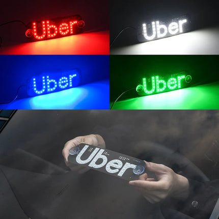 Uber LED verlicht identificatiebord voor auto met USB-aansluiting, aan/uit-schakelaar en twee zuignappen voor bevestiging aan de autoruit, inclusief groen verlicht Uber-logo.
