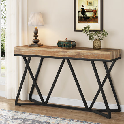 Industriële sidetable MEGIVEZ van 140 cm breed met bruin houten tafelblad van 10 cm dik, zwart geometrisch metalen onderstel, 30 cm diep en 90,5 cm hoog.